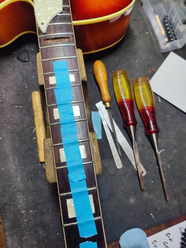 A stack of mahogany neck blanks await machining